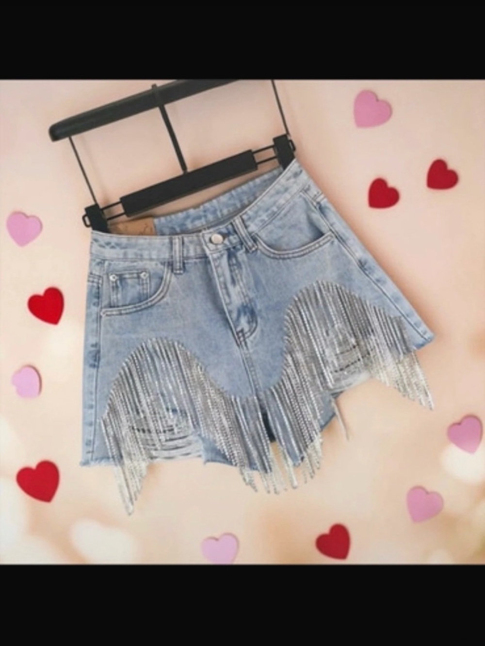 lite wash distressed denim shorts featuring rhinestone fringe